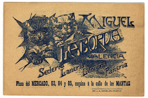 Ein altes Geschäftsblatt mit einem Foto von zwei Katzen und einem Text, der die Katzen beschreibt.