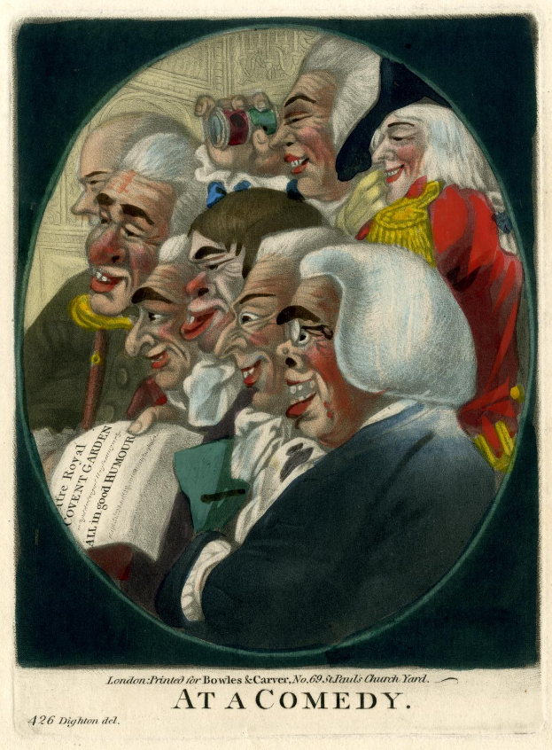 Eine Gruppe von Menschen, die in einem Kreis lachen, einer hält ein Blatt Papier in der Hand, mit dem Text "Bei einer Komödie" unten.